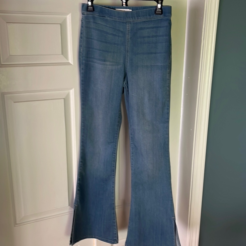 Soft bell bottom pull on jeans with side split on bell bottoms. Size medium